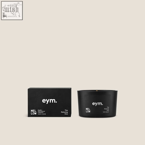 Black cylindrical mini candle mellow with minimalist white branding the relaxing one in a matching black box