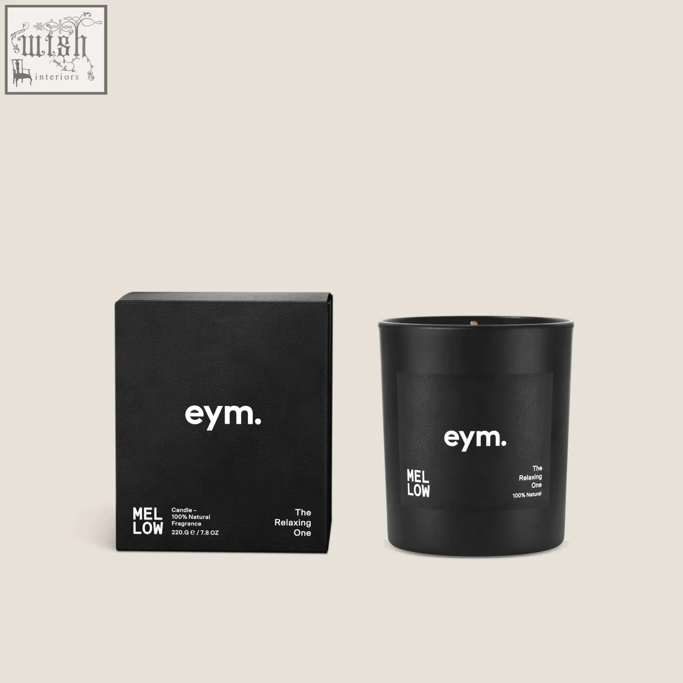 Black matte glass standard candle jar with white minimalist branding and wick next to its matching box mellow standard candle