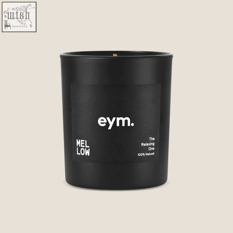 Black matte glass standard candle jar with minimalist eym label and mellow scent name in white text