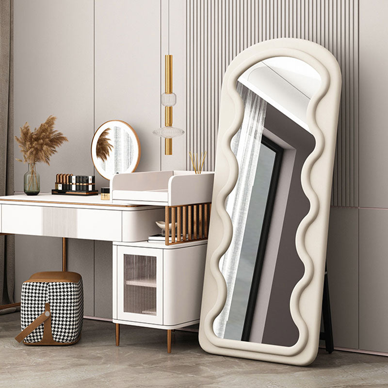 Melody full length mirror with a tall cream-colored frame and wavy padded design perfect for any room