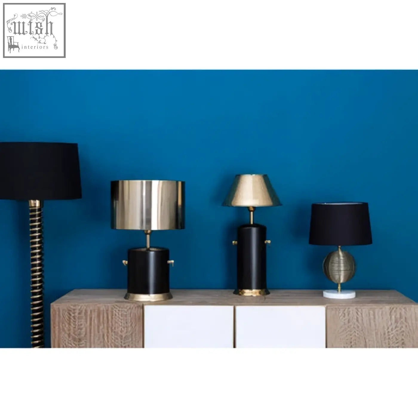 The melora round marble gold finish table lamp base features a gold finish and marble gold finish on a wooden console