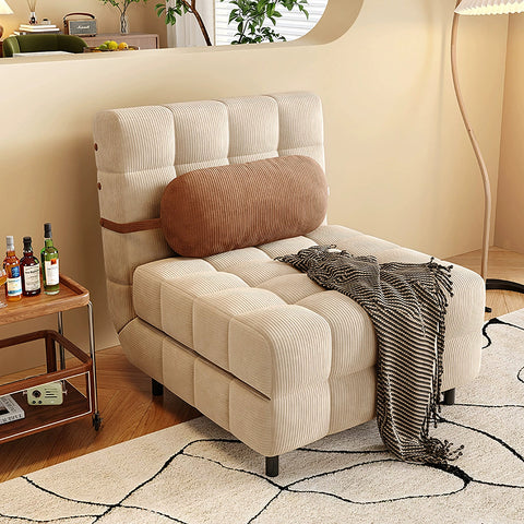 Beige corduroy tufted mendez single sofa bed with brown cylindrical pillow and black fringed throw blanket