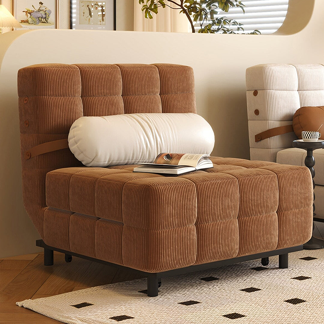 Brown corduroy tufted mendez single sofa bed with white pillow and open book on seat two seater sofa bed