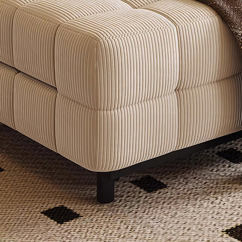 Cream-colored corduroy ottoman with tufted ribbed upholstery and black metal legs for mendez sofa bed