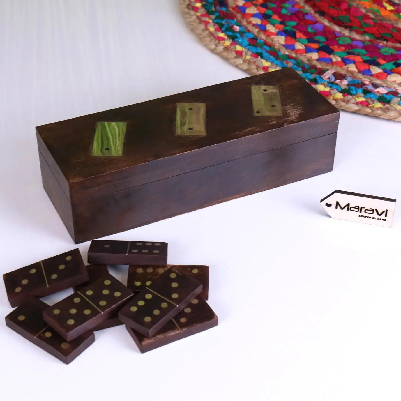 Dark brown mera wooden domino set with brass accents and gold dot inlays in a matching rectangular storage box