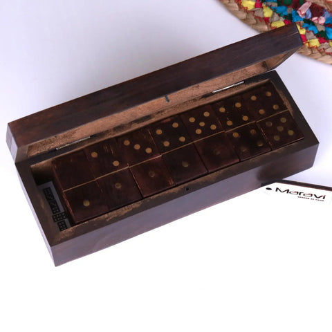 Dark brown wooden domino set with brass colored dots in a mera wooden domino storage box