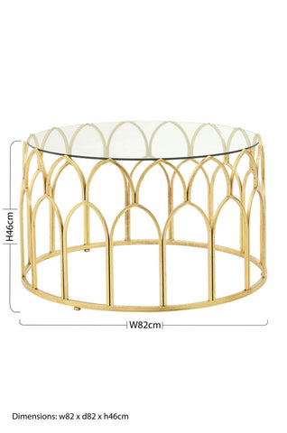 Merlin gold leaf coffee table with gold toned metal frame and clear glass top featuring an arched cage like base