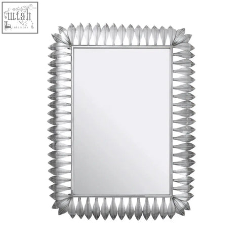 Merlin silver leaf frame wall mirror with a silver-framed rectangular design and decorative spiky leaf frame border