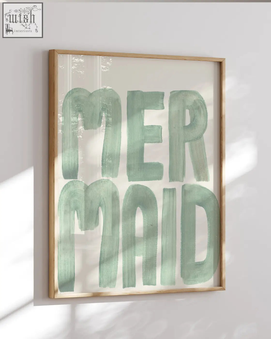 A framed mermaid word art print with mint-green acrylic paint brushstroke font from the sea collection