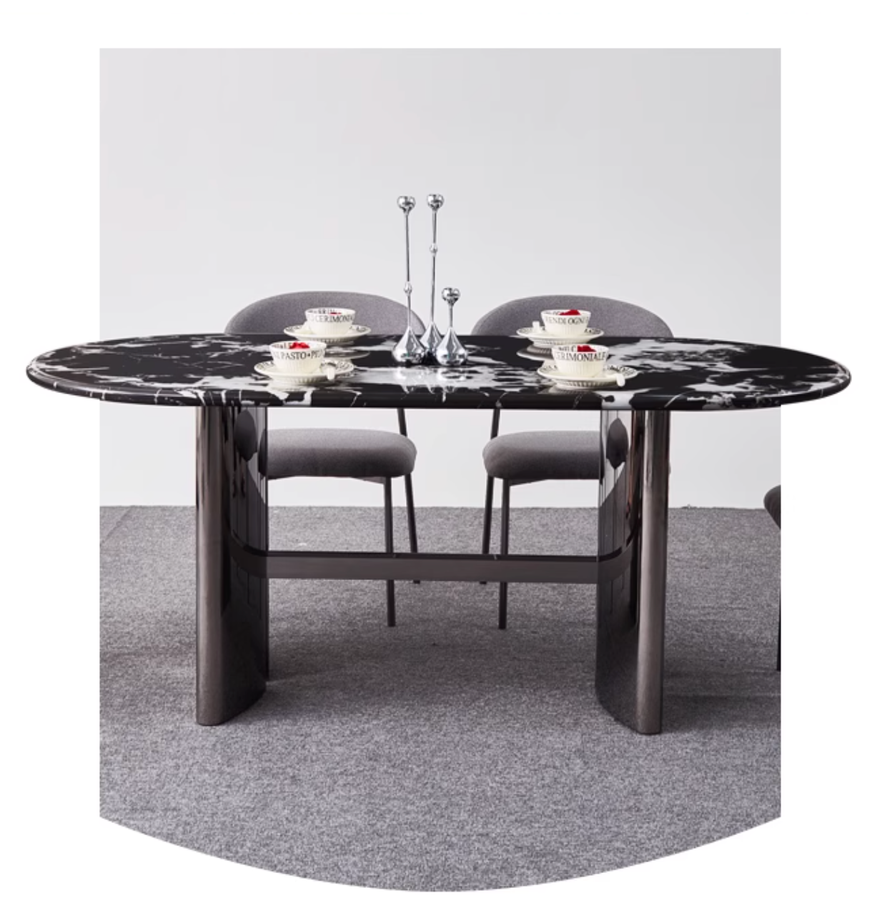 Black marble meroy dining table with oval top and polished chrome legs for a sleek modern dining setup
