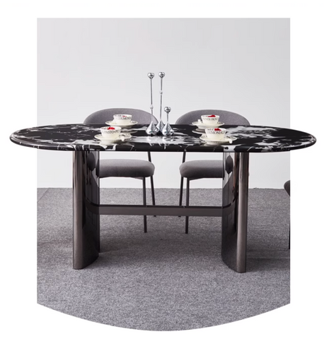 Black marble meroy dining table with oval top and polished chrome legs for a sleek modern dining setup