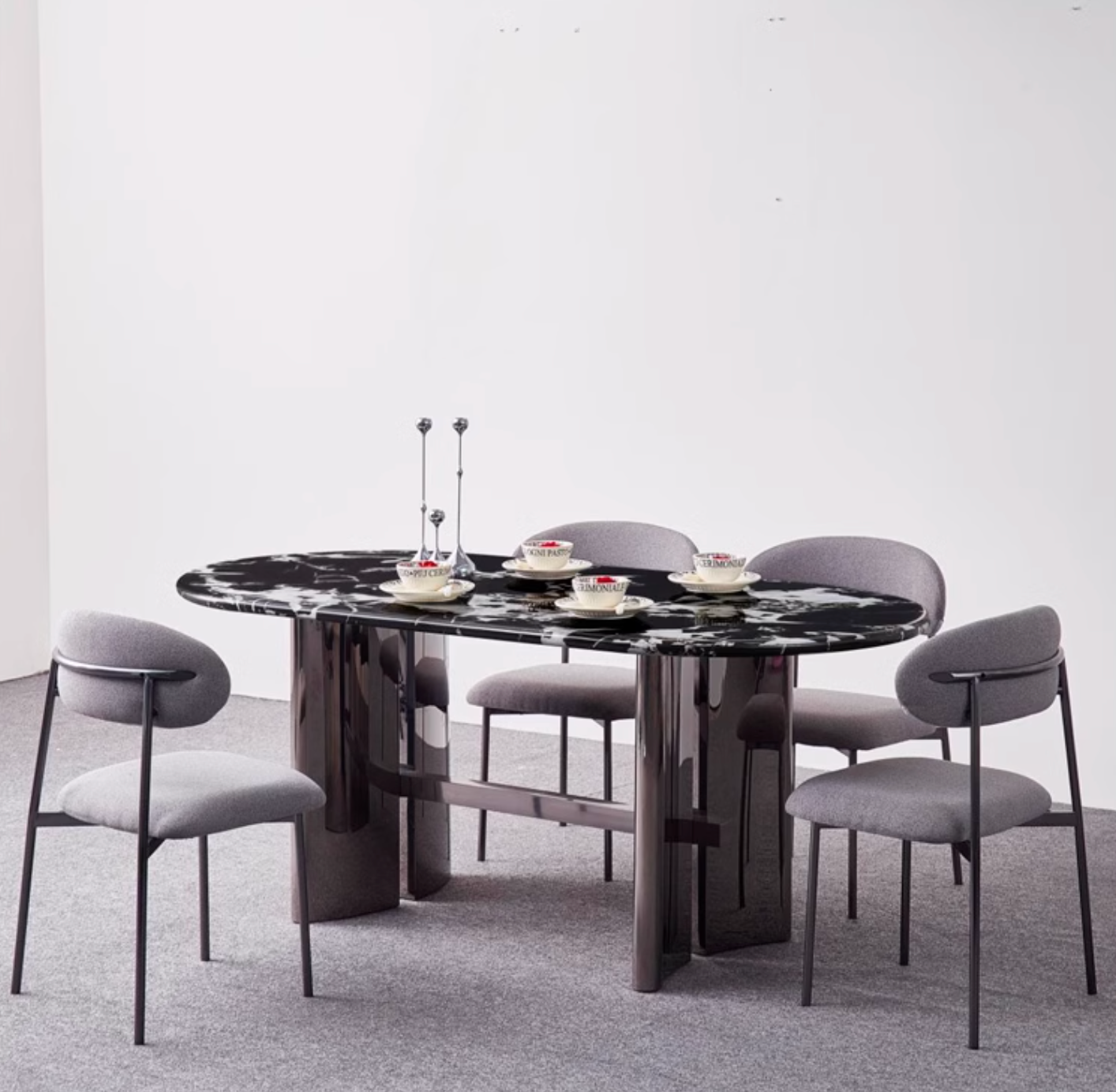 Black marble meroy dining table with sleek polished chrome legs and modern oval shape for stylish dining