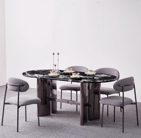 Black marble meroy dining table with sleek polished chrome legs and modern oval shape for stylish dining