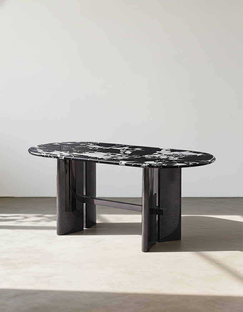 Meroy dining table with black and white marble oval top and sleek glossy black cylindrical legs perfect dining table