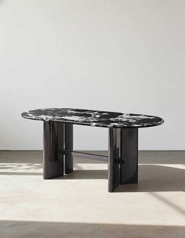 Meroy dining table with black and white marble oval top and sleek glossy black cylindrical legs perfect dining table