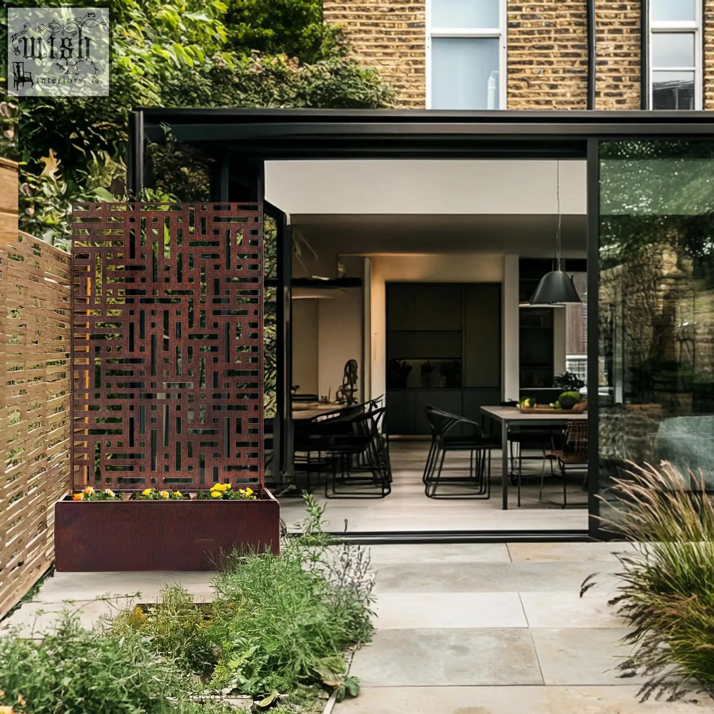 Rust-colored metal indoor outdoor privacy screen with geometric cutouts and planter box at base 90cm x 180cm