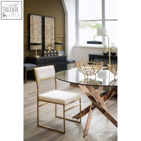 Gold-finished dining chair with milky white velvet upholstered seat and backrest for stylish dining rooms