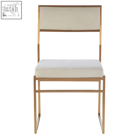 Gold-toned metal frame dining chair with milky white velvet upholstered seat and back for stylish dining