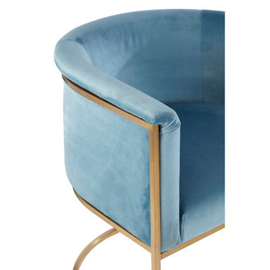 A sleek mias blue velvet chair with a curved gold metal frame perfect as a stylish blue velvet chair