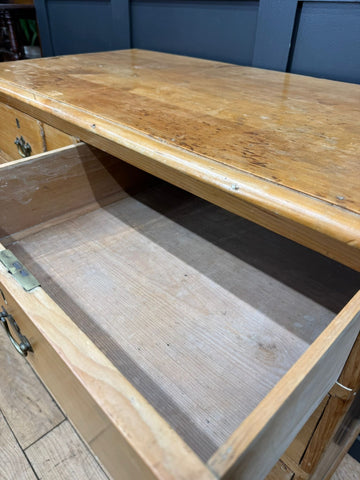 Mid victorian rustic pine chest of drawers with rounded corners light wood worn polished top and visible drawer hardware