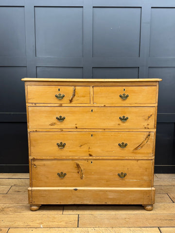 Mid victorian rustic pine chest of drawers with rounded corners brass crown handles and visible wood grain