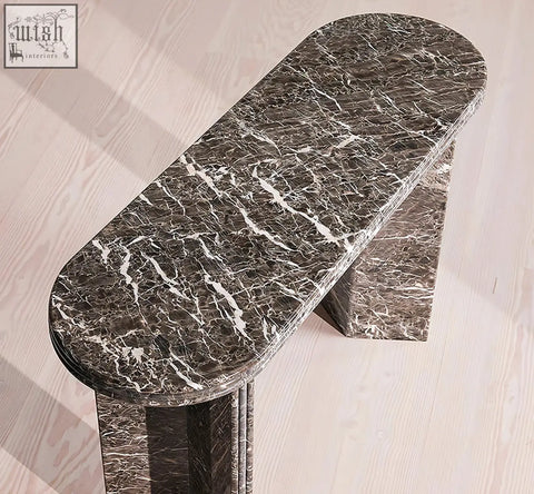 Dark gray black console table with sleek modern design and natural marble surface featuring white veining
