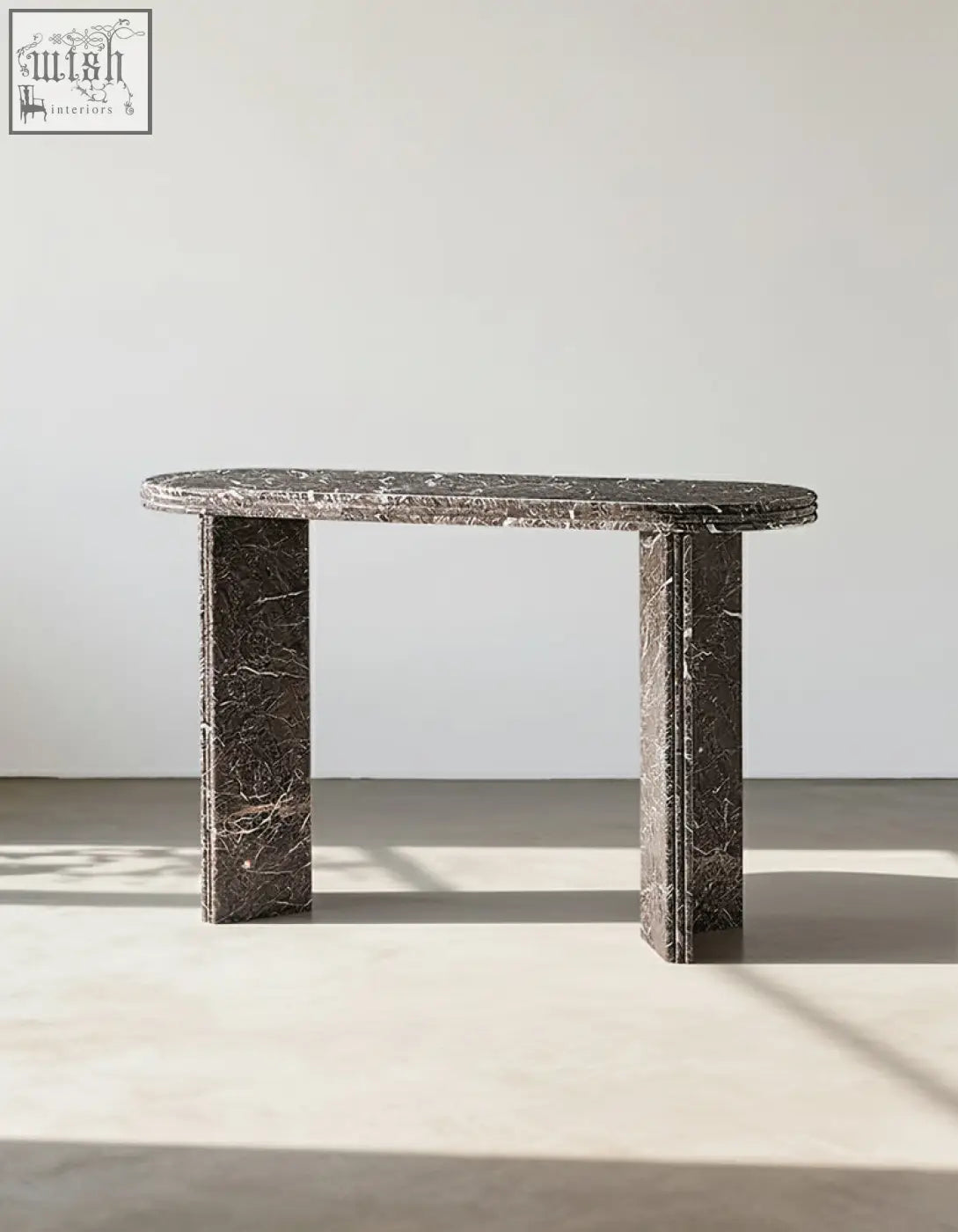 Midnight luxe console table featuring a dark gray black console table with natural marble surface and thick legs