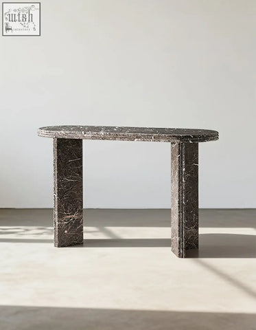 Midnight luxe console table featuring a dark gray black console table with natural marble surface and thick legs