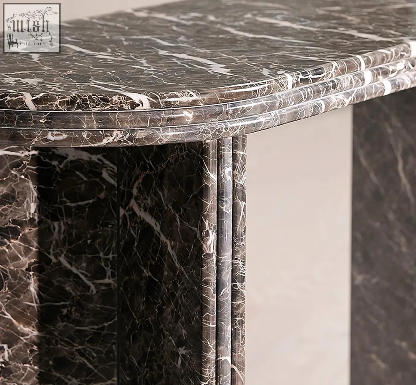 Elegant midnight luxe console table with black natural marble surface featuring dark gray and flowing white veining