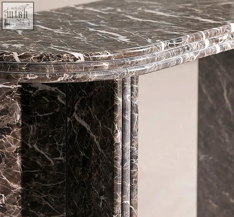 Elegant midnight luxe console table with black natural marble surface featuring dark gray and flowing white veining