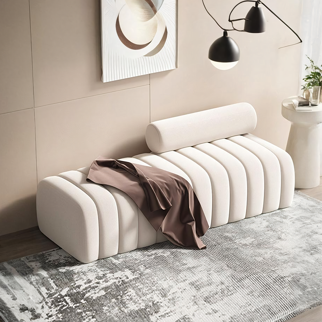 Cream-colored tufted mignon bread bench with cylindrical backrest and soft brown velvet fabric draped over it