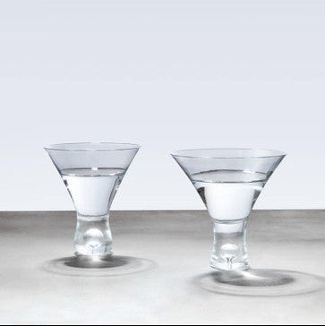Two clear glass cocktail glasses with faceted stems and wide tapered bowls from mila set of 2 clear cocktail glasses