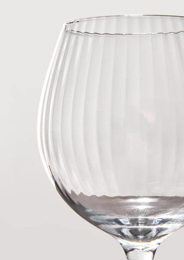 Clear glass Mila set gin glasses with slender stem and vertical fluted texture perfect for serving gin
