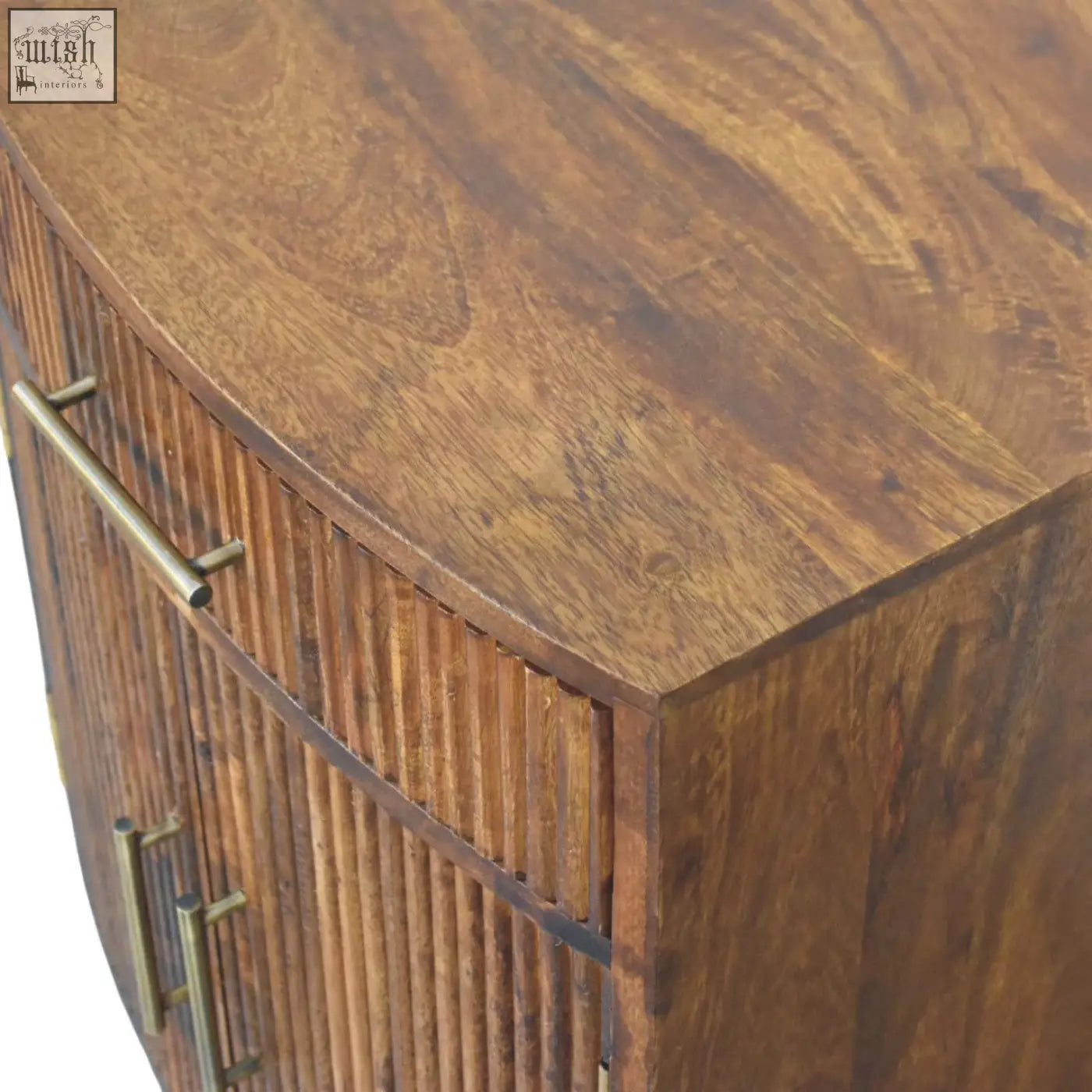 Curved wooden milan fluted bedside cabinet with warm brown finish vertical slatted sides and brass handles