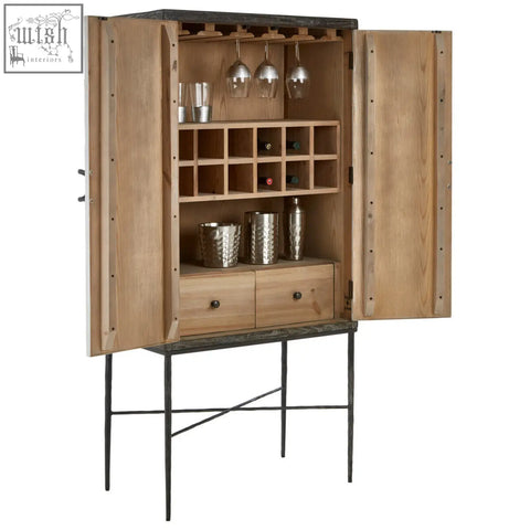 Milan two door elm wood wine cabinet with light wood finish, dark metal accents, and open shelving for wine and glasses