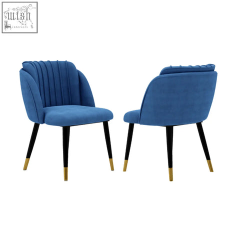 Pair of modern blue velvet dining chairs with black legs and gold tips milano velvet dining chair