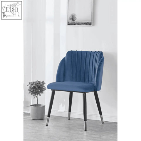 Blue velvet milano velvet dining chair with vertical pleats and black metal legs capped in silver for dining room use