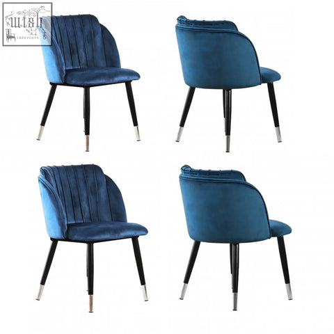 Deep blue milano velvet dining chair with sleek black legs and silver caps perfect velvet dining chair option