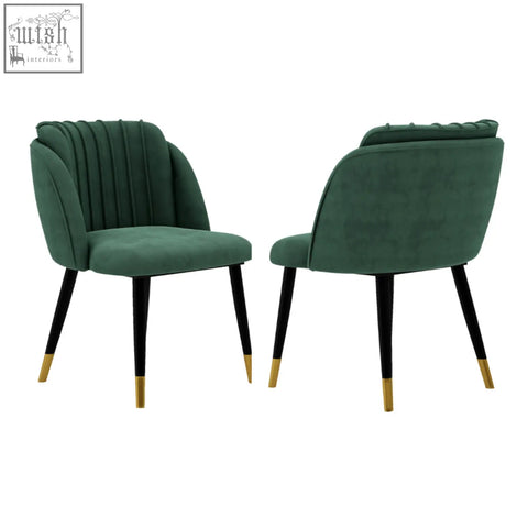 Emerald green velvet dining chair with black legs and gold-tipped feet perfect for milano velvet dining setups