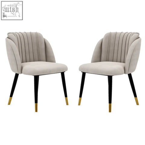 Beige milano velvet dining chair with black legs and gold-tipped feet perfect velvet dining chair for stylish meals