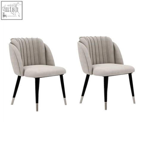 Beige milano velvet dining chair with black tapered legs and silver caps for stylish velvet dining seating