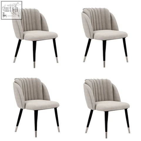 Beige milano velvet dining chair with black tapered legs and silver caps perfect as a velvet dining chair