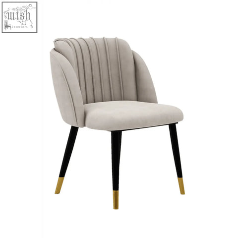 Beige milano velvet dining chair with ribbed back and black legs with gold tips perfect velvet dining chair