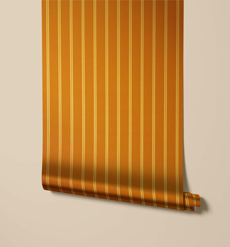 A roll of miller warm orange pinstripe wallpaper with thin vertical gold stripes perfect for stylish walls