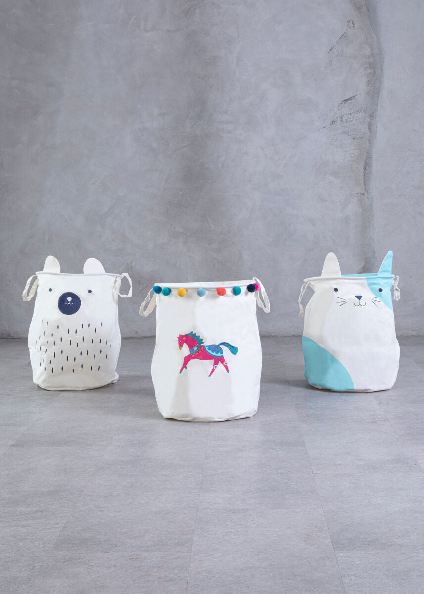 White fabric mimo cat face laundry bag with embroidered animal faces and colorful pom-pom accents