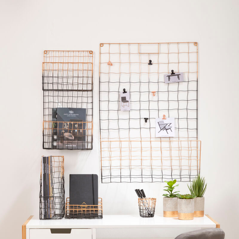 Copper-toned wire grid mimo magazine holder with black mesh pockets and clips holding photos for wall organization