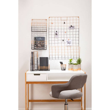 The mimo magazine holder desk features a sleek white surface with light wood legs and two drawers with a gray chair