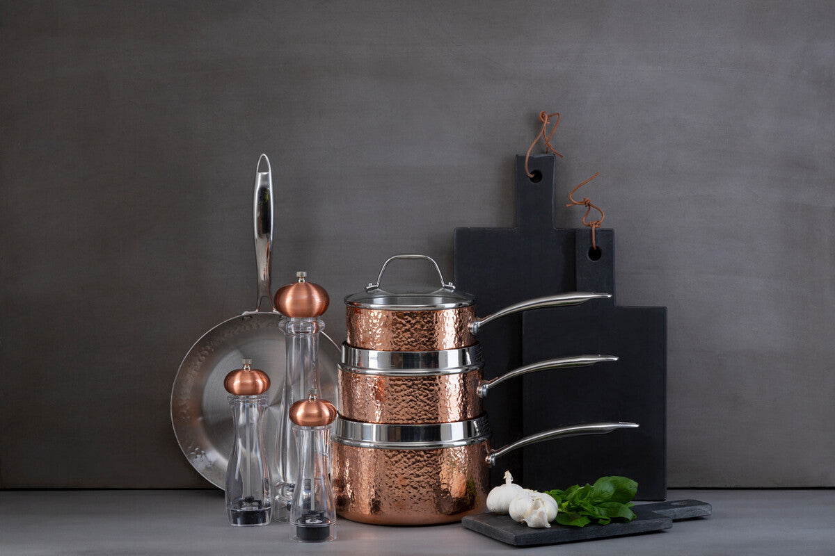 Stacked Minerva copper finish large hammered saucepans with stainless steel rims and lids in copper finish large design