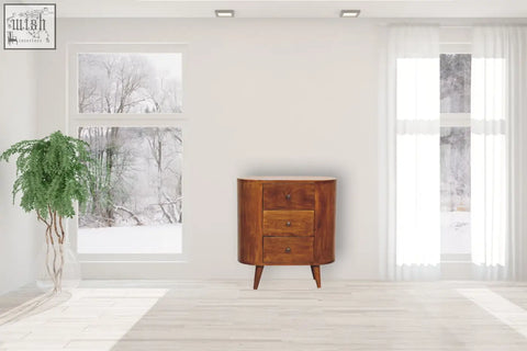 Mini chestnut chest of drawers in warm amber-brown mango wood with three curved drawers and ample storage