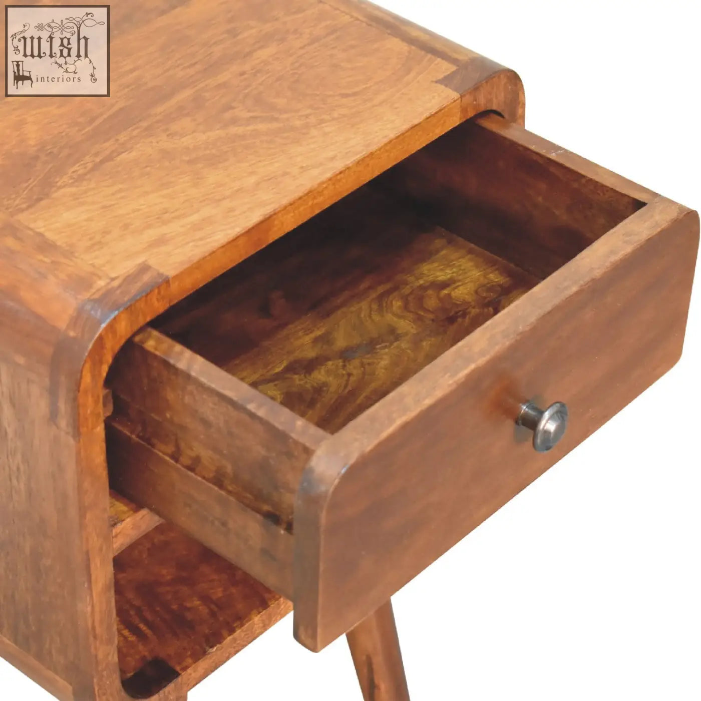 A warm-toned wooden mini chestnut curve lower bedside table with a drawer and silver knob showing wood grain